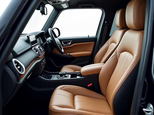 A beautifully clean and detailed car interior with leather seats.